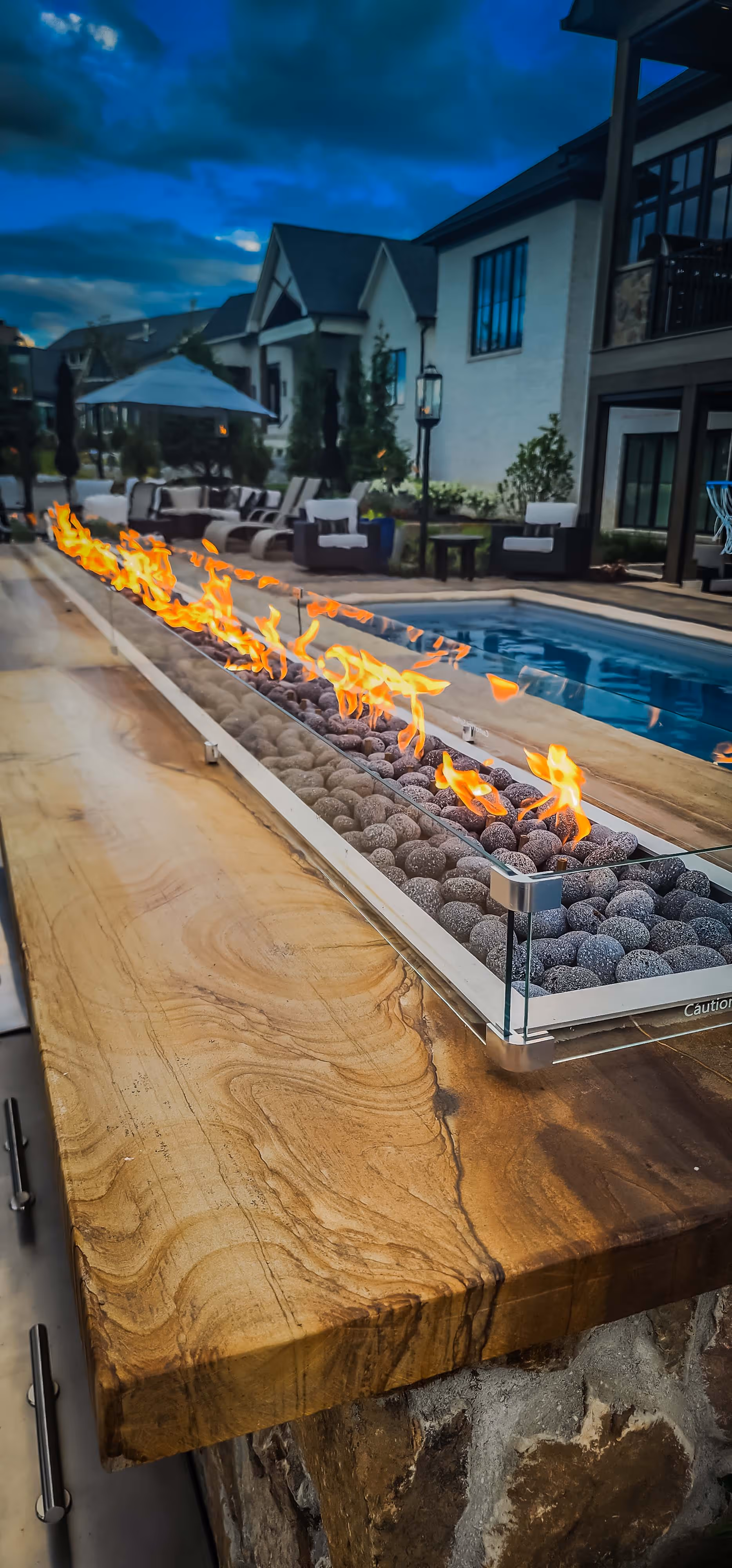 large unique fire element next to swimming pool